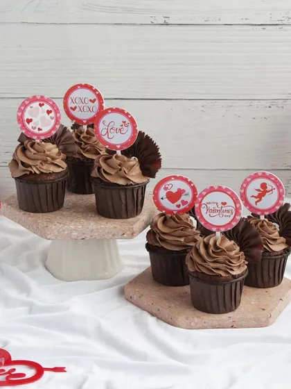 A mix of our Valentine's chocolate cupcakes, some with decorative picks to add a festive touch. Perfect for sharing with your special someone.