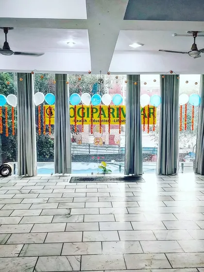 Our studio decorated for our one-year anniversary celebration. It's more than a yoga space; it's a home for our parivaar.