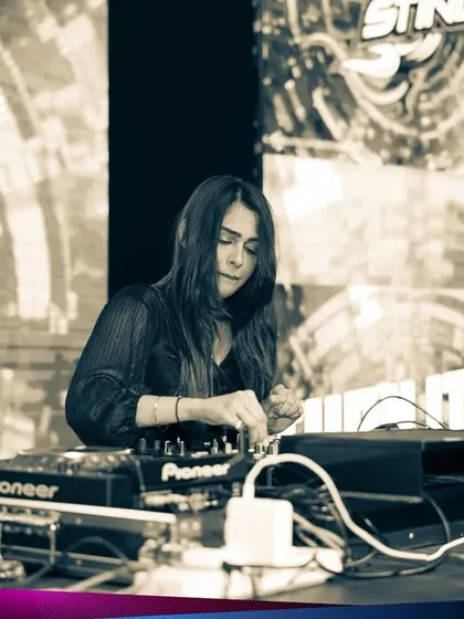 A black and white shot of me focused on the decks at the Kaavaalaa music festival. Even in a massive festival environment, precision and focus are key to a great set.