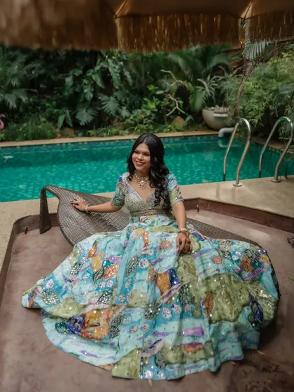 A poolside shot from the welcome event. The makeup is perfect for a daytime, outdoor celebration.