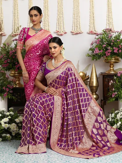 A repeat of the stunning image of two models in our rani pink and royal purple Bandhani sarees.