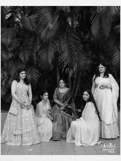 A classic black and white group portrait of the bride and her bridesmaids, a timeless keepsake of their friendship.