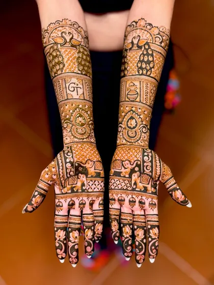 A straight-on view of the "GT" initial design, showing the peacocks, elephants, and kalash motifs.
