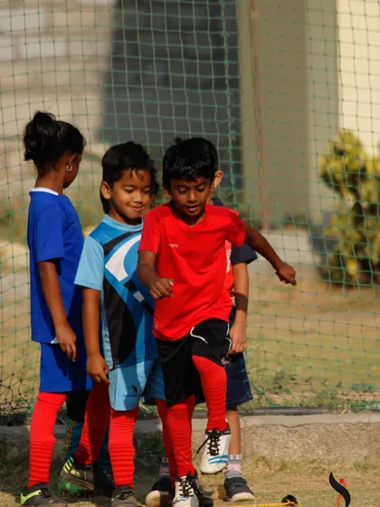 A duplicate of image 58, highlighting the supportive team environment as players go through their training drills.