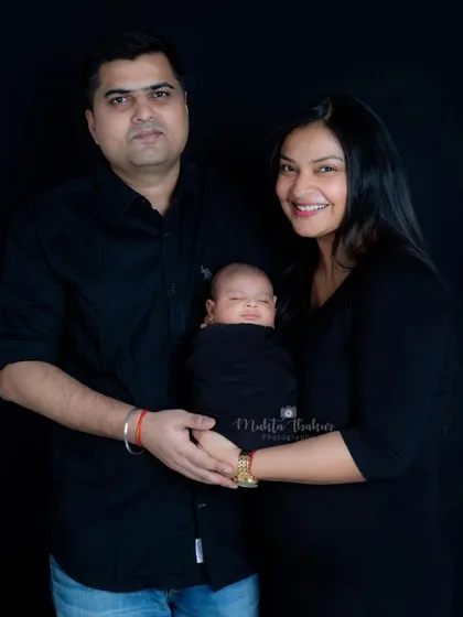 The perfect family of three. These first portraits as a new family are memories that will last a lifetime.