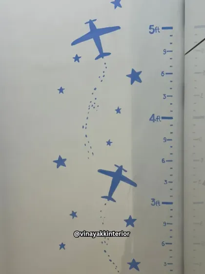 Functionality is key, even in a themed room. This custom height chart with airplane motifs allows parents to track their child's growth while perfectly matching the room's adventurous decor.