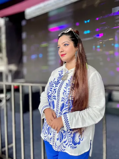 A candid moment in a stylish Indo-western outfit. This look, with its intricate blue embroidery, is perfect for a contemporary yet traditional event, reflecting my personal style.