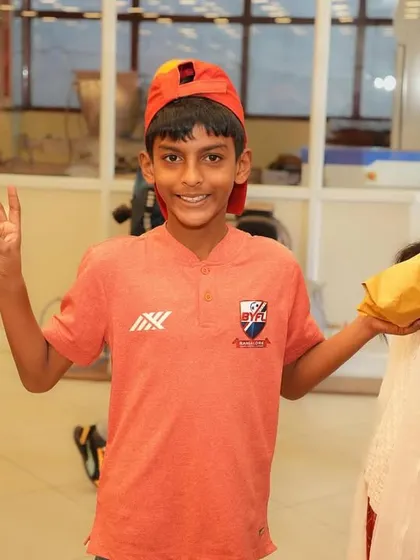 A player shows off his chocolate haul with a peace sign and a big smile.
