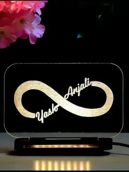 A simple yet powerful gift. This acrylic LED lamp features an infinity symbol with the couple's names engraved, symbolizing their endless love. It's great for room decor or as a wedding gift.
