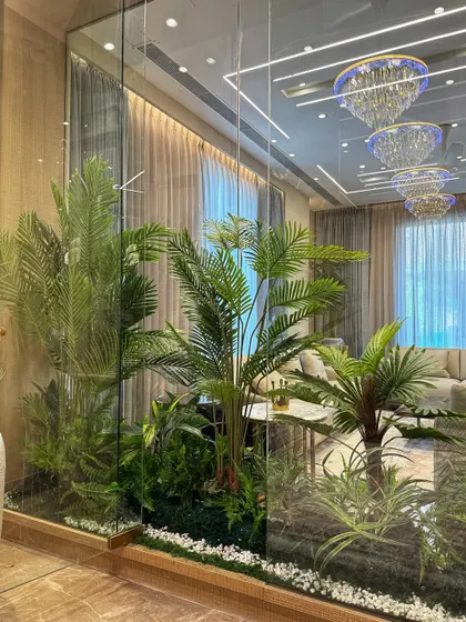 Another view of the indoor artificial garden, showing how it is reflected in the surrounding glass and mirrors, making the space feel even larger and greener.