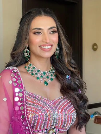 A close-up portrait from her Mehendi. The focus is on her flawless skin and the soft brown eyeshadow that defines her eyes without being heavy.