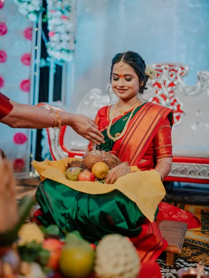 A candid moment of the bride-to-be during a traditional engagement ritual.