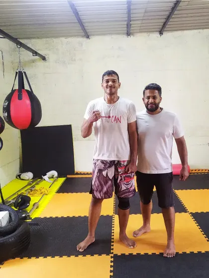 With a student after a Sunday kickboxing session. We offer weekend batches for kids, students, and working professionals.