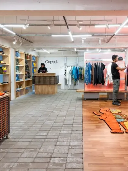 The main retail space, showing the blend of the pegboard-style shelving, the central display, and the clothing racks.