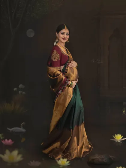A standing portrait that captures the full splendor of the Kanjeevaram saree against the artistic backdrop. The composition is carefully balanced to create a sense of grandeur and timelessness.
