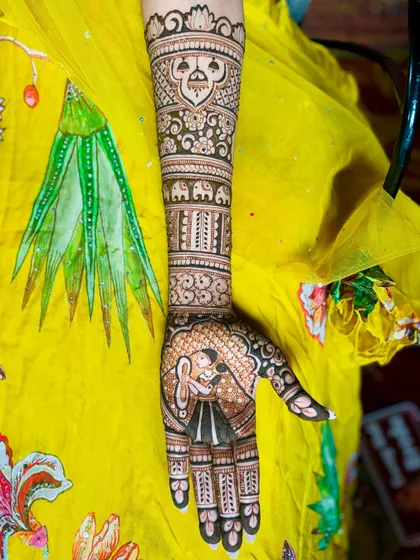 This design features a lovely portrait of the bride looking in a mirror on one hand, and the couple together on the other.
