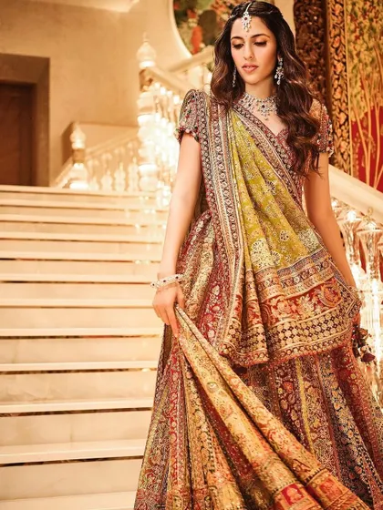 The full view of the magnificent Tarun Tahiliani lehenga. The rich colors and traditional Gujarati embroidery are perfect for a festive dance celebration.