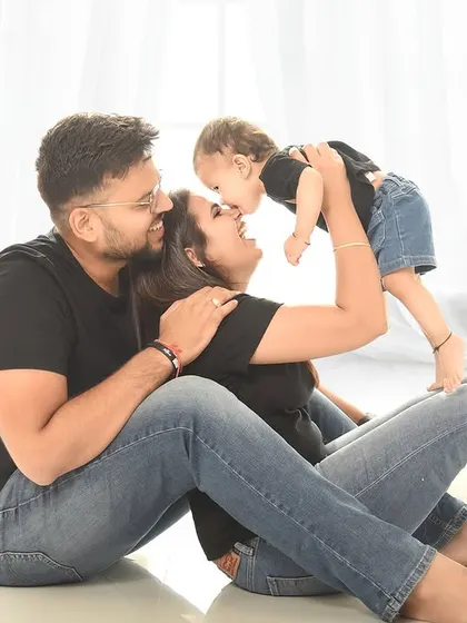 A sweet kiss for mom. Capturing these unscripted moments of affection is what makes family photography so special.