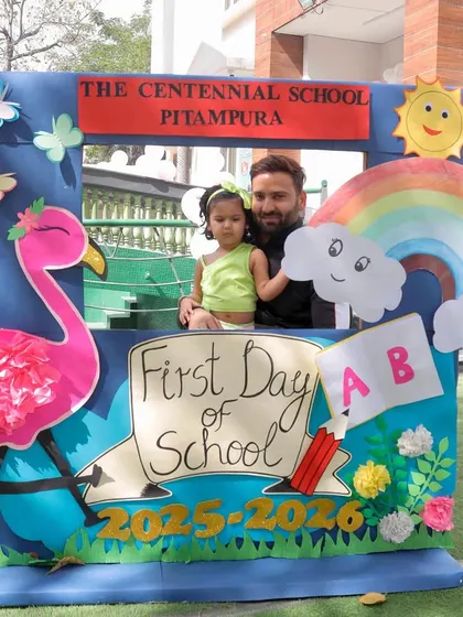 A proud father joins his little one for a photo on the first day of school. We love seeing our families share in these important milestones, marking the beginning of a new adventure.