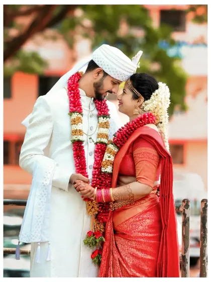 A quiet, loving glance between the bride and groom. We focus on capturing these unscripted, natural moments that truly define your wedding day in Mangalore.