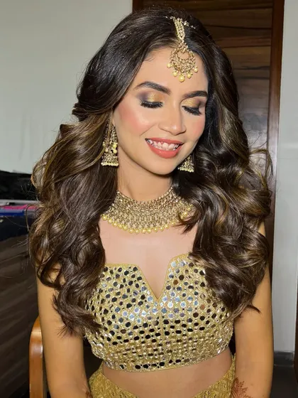 A close-up of the golden glittery eye makeup. This look is designed to sparkle and shine on the dance floor.