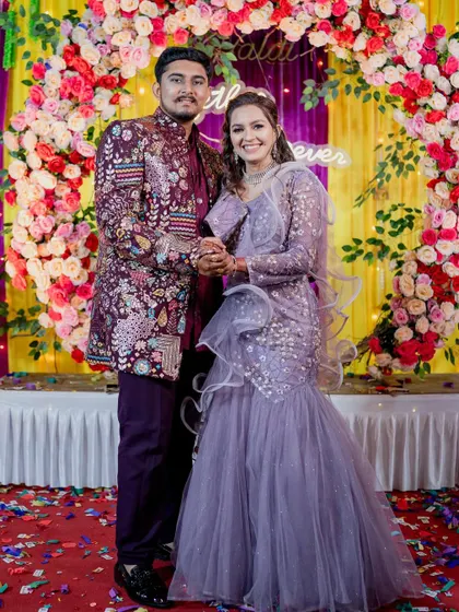 Stand out in a crowd with this bold and festive look. My client is wearing a heavily embroidered maroon Indo-Western sherwani, an excellent choice for a vibrant sangeet or wedding celebration. It’s all about celebrating in style.