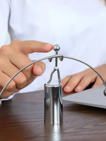 This steel balance toy is a fascinating desk accessory that adds a bit of fun and physics to the workspace. It's a great conversation starter and a unique gift for a colleague or boss.