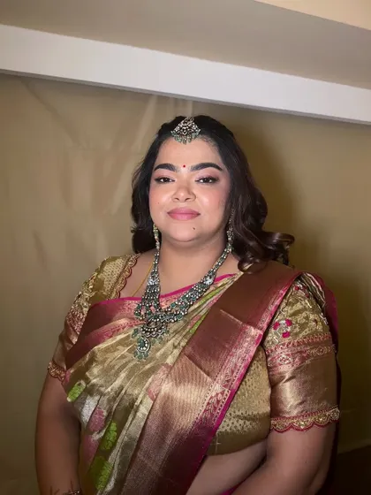 This client looks radiant in her traditional attire. The makeup is kept soft and elegant to complement her ornate jewellery and the rich colors of her saree.