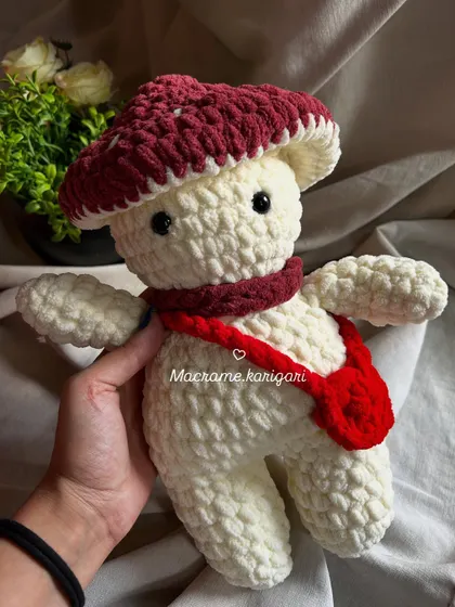 Holding our handmade mushroom toy. It's a great size for cuddling and imaginative play.
