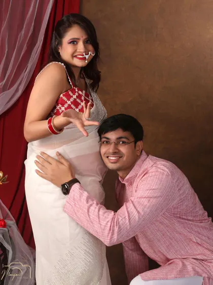 A playful and classic bump-listening pose. His happy expression is priceless.