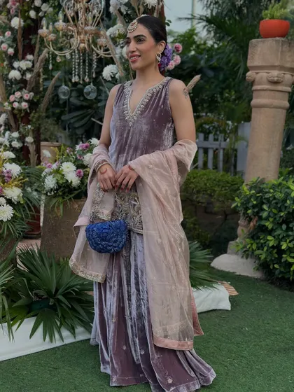 A full shot of my self-designed velvet sharara, complete with a statement blue bag from Doux Amour. The color combination is unexpected but works beautifully.