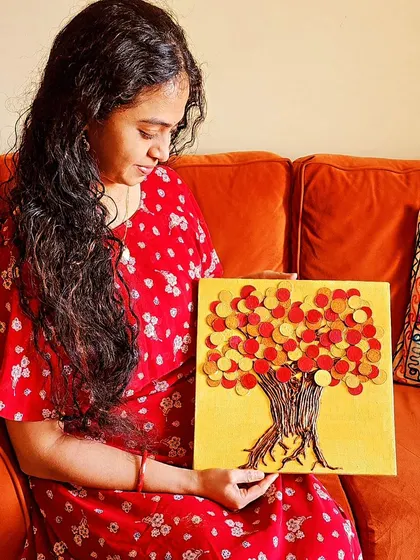 A client admiring her new Vaastu painting. It's always a joy to see my art find its rightful place, ready to start its work of balancing and enhancing the home's energy.