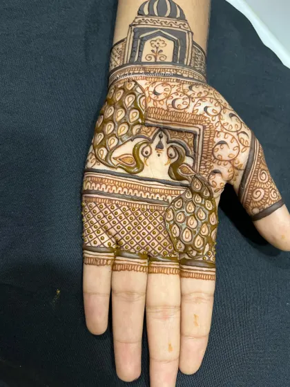 Another stage of the peacock design, showing a different style of filling for the peacock's body.