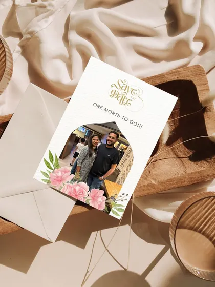 A personal touch for a Save the Date countdown. This design incorporates a photo of the couple within a floral arch, making the announcement feel intimate and special.