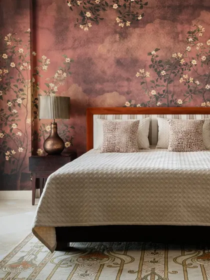 To capture the feeling of autumn, I designed this bedroom wallpaper with a moody, textured background and delicate flowering branches. The deep rust and earthy tones create a warm, cozy retreat that feels like a permanent golden hour.