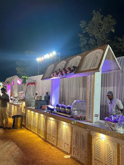 A closer look at the details of my traditional white and gold themed buffet station. Every setup includes professional chafing dishes to keep the food warm and fresh, and my uniformed staff is always on hand to ensure your guests are well taken care of.