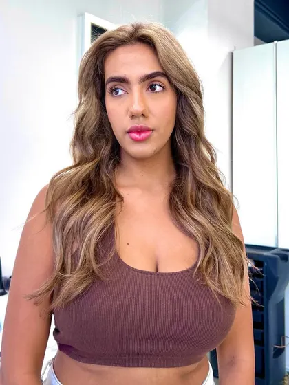 A 'free lights' hair transformation, resulting in a beautiful, sun-kissed blonde look that is both striking and natural.