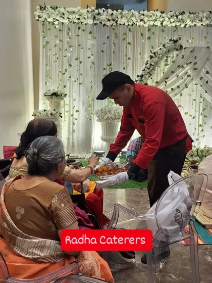 My staff serving appetizers to guests seated during a Janyu ceremony. Attentive service is key, especially for elderly guests and during important rituals.