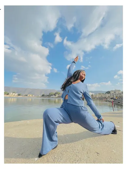 Finding a moment for a reverse warrior pose by the serene lake in Pushkar, Rajasthan. Yoga can be practiced anywhere, connecting you to the energy of your surroundings.