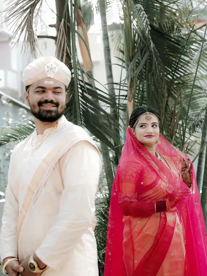 A candid shot of the couple sharing a happy, natural moment together outdoors.