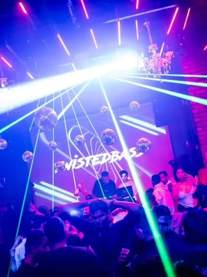 My 'TwistedBass' logo on the screen at Roxy, with lasers cutting through the smoke. The visual production is a huge part of my show.