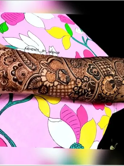 A detailed view of an arm sleeve design, featuring a mix of floral, paisley, and geometric patterns.