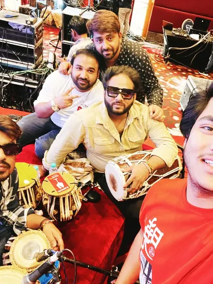 A selfie with my bandmates from Saaz-e-Mehfil during a show. We always have a great time performing together.