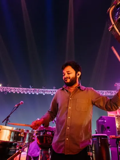 Playing the timbales and a large bass drum during a live concert with Asees Kaur in Jajpur. This setup is perfect for creating powerful, driving rhythms for large outdoor events.