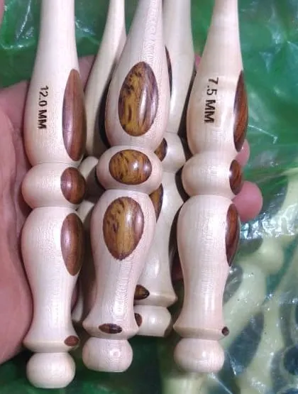 A close up of my light-wood hooks with a distinctive grain pattern. The size, like the 7.5 MM and 12.0 MM shown here, is clearly marked for your convenience.