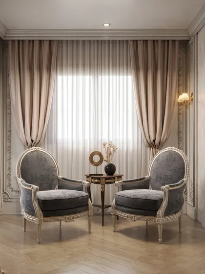 A quiet seating area within the master suite, with classic armchairs and intricate wall details, perfect for relaxation.