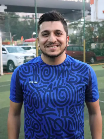 Coach Shadab, the heart of the academy, looking happy and proud on the training ground.