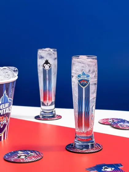 A high-energy, graphic shot for the Bira 91 and Delhi Capitals IPL collaboration. I used the team's bold red and blue colors as the background to create a powerful, sporty visual for their branded merchandise.