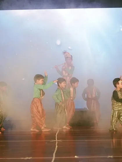 I use special effects like theatrical smoke to add excitement and a professional feel to student performances. This moment captures the energy of a dance sequence during the Maple Bear annual day celebration.