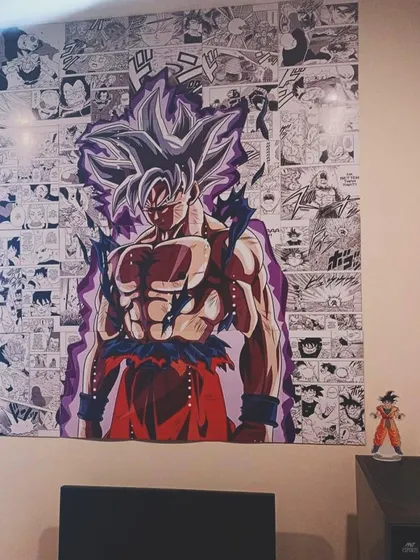 For the anime fan, this custom Goku wallpaper from Dragon Ball Z makes a powerful statement. The design features a manga panel collage in the background.